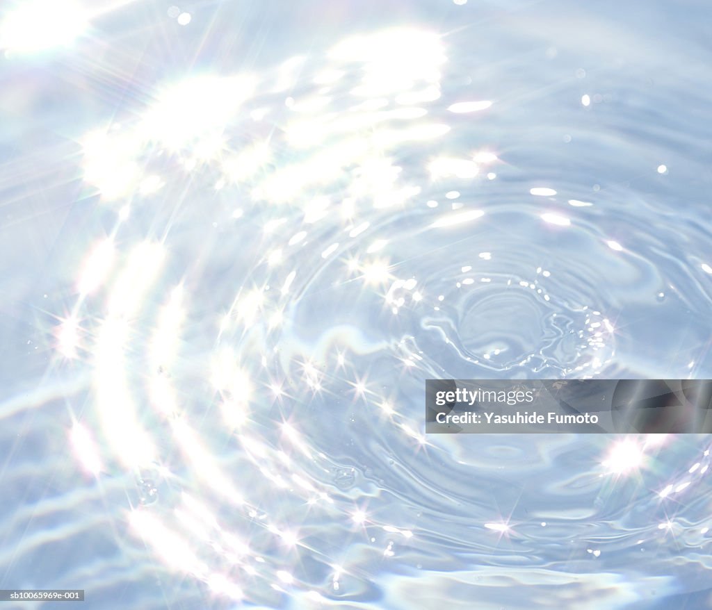 Light reflecting in water, close-up (digital composite)