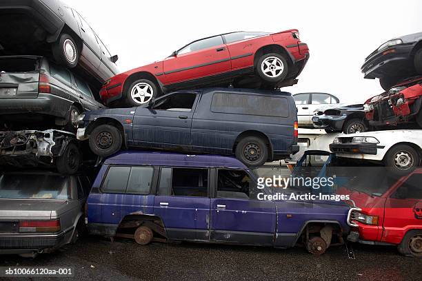pile of cars in junkyard - junkyard stock pictures, royalty-free photos & images