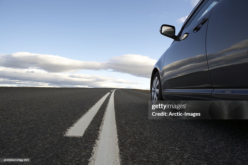 Car on road in non-urban setting