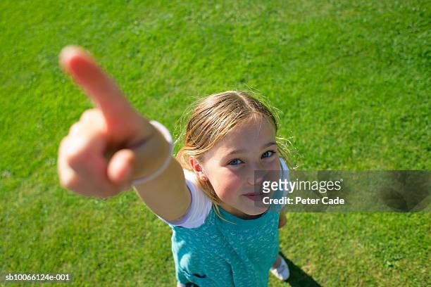 portrait of girl (8-9) pointing, elevated view - girl pointing bildbanksfoton och bilder