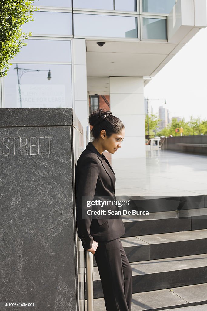 Young business woman outside office building