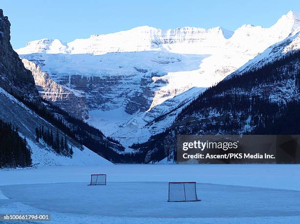 hockey net on frozen lake - outdoor hockey stock pictures, royalty-free photos & images