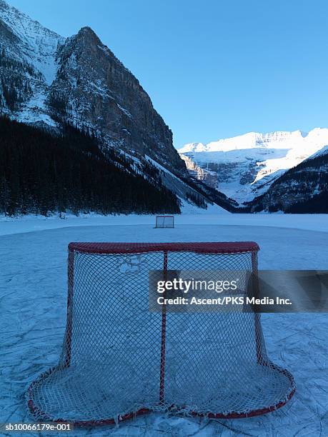 hockey net on frozen lake - hockey net stock pictures, royalty-free photos & images