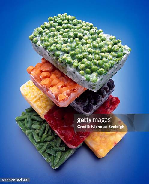 stack of frozen vegetables - cibi surgelati foto e immagini stock