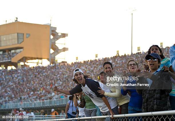 crowd in stadium watching stock car racing, cheering - crowd excitement stock pictures, royalty-free photos & images