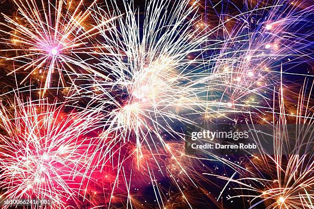 fireworks display at night, low angle view - firework display imagens e fotografias de stock