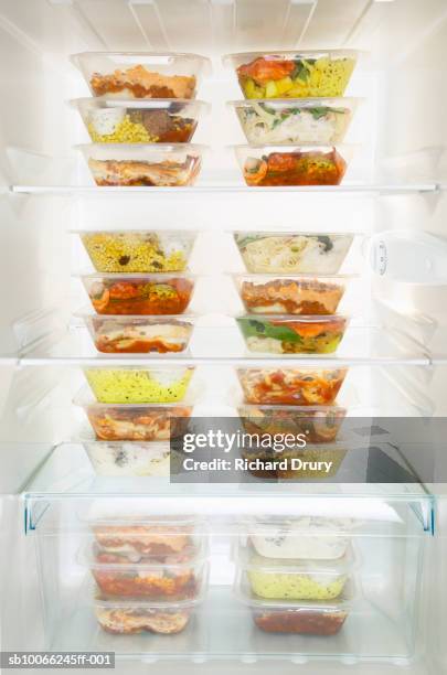 refrigerator filled with ready-to-eat meals - refrigerator front stock pictures, royalty-free photos & images