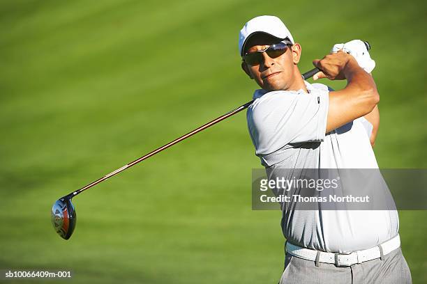 male golfer on golf course - golfer stock pictures, royalty-free photos & images