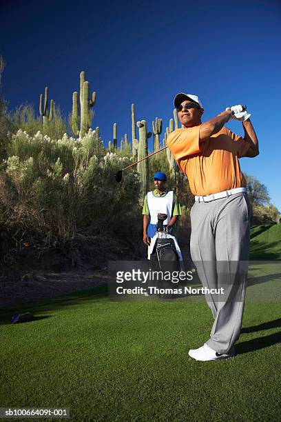 two male golfers on golf course - golf accessories stock pictures, royalty-free photos & images