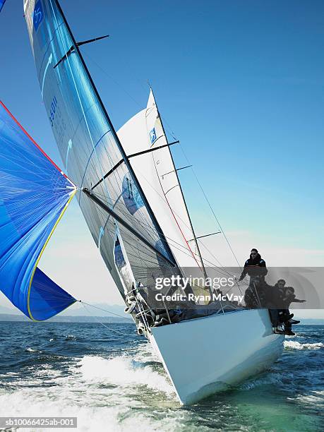 crew members on racing yacht - sailing team stock-fotos und bilder