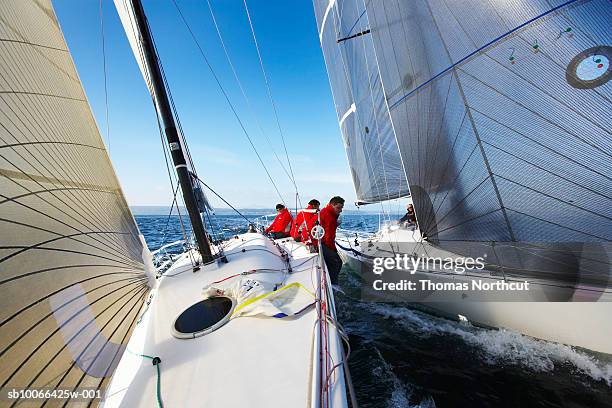 crew members on racing yacht - sailing race stock pictures, royalty-free photos & images