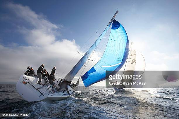 crew members on racing yacht - segeln stock-fotos und bilder
