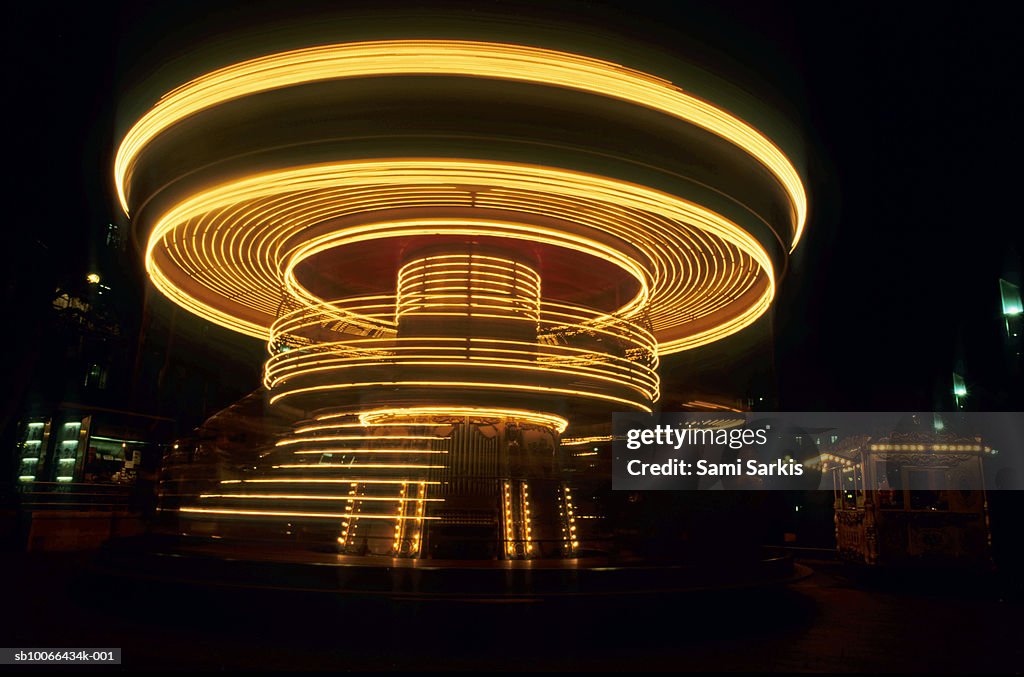 France, Marseille, spinning old fashioned carousel at night