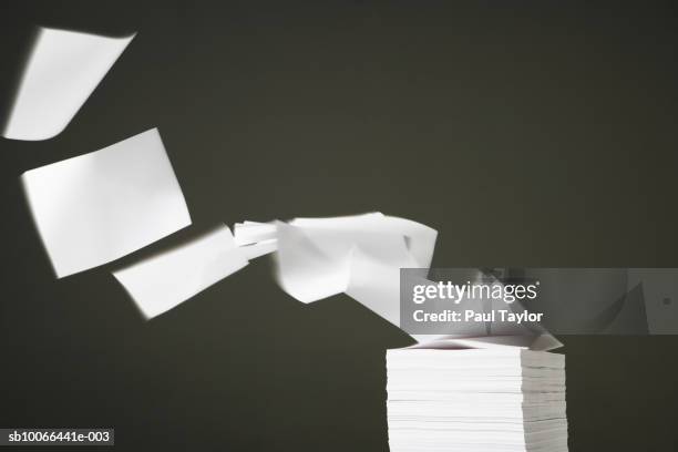 white blank papers blowing off stack, close-up - paper blowing stock pictures, royalty-free photos & images