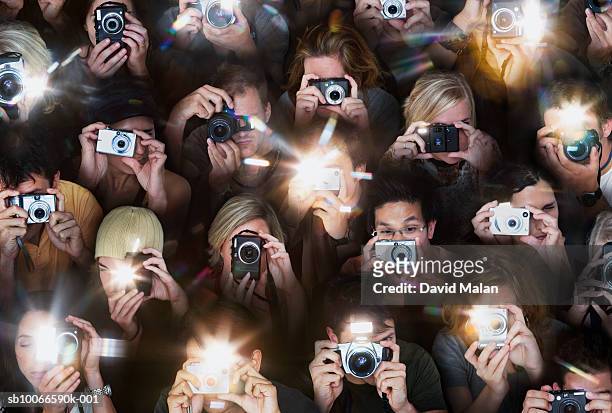 crowd of people taking photos with small cameras, high angle view - macchina fotografica digitale foto e immagini stock