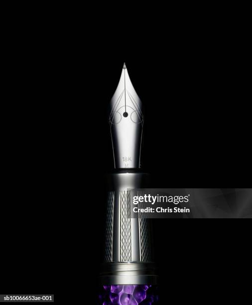 pen tip on black background - fountain pen stock pictures, royalty-free photos & images