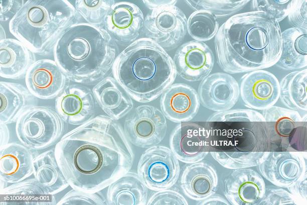 overhead view of empty plastic bottles (full frame) - plastikmaterial stock-fotos und bilder