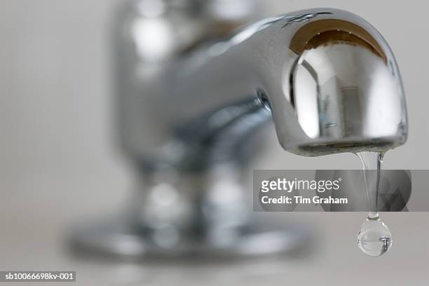 water drips from domestic tap, uk - running water stock-fotos und bilder