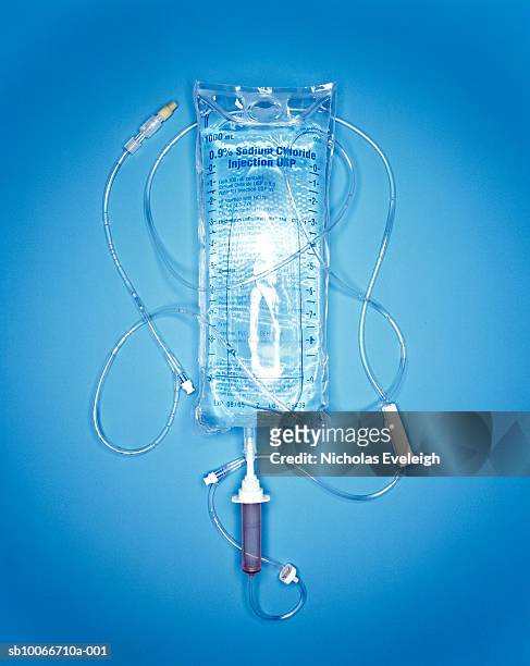sodium chlorde injection bag and tubes, studio shot - iv bag stock pictures, royalty-free photos & images