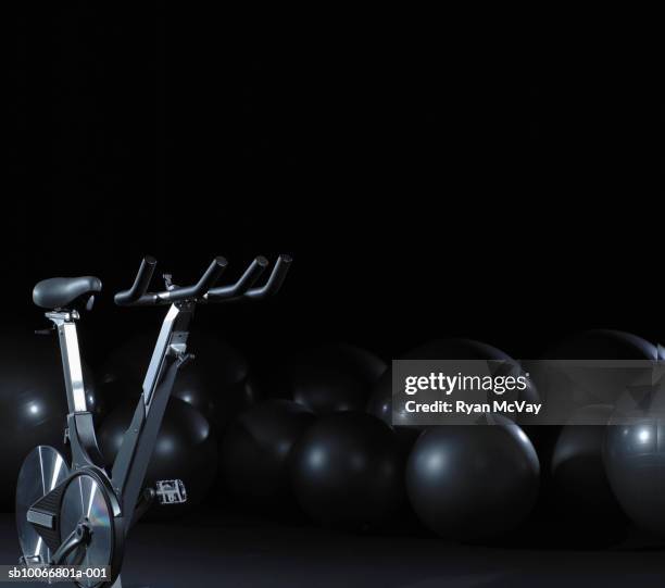 exercise bike and fitness balls - peloton stock pictures, royalty-free photos & images