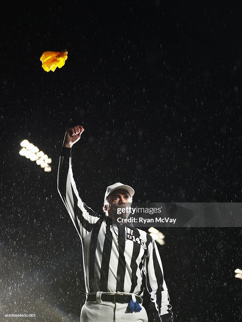 Referee tossing yellow flag