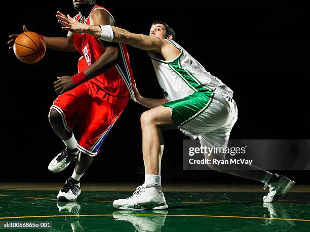 two young men playing basketball - basket ball player stock pictures, royalty-free photos & images