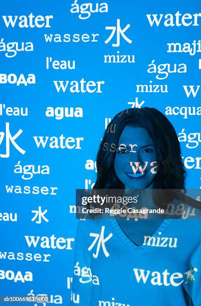 visual projection of pattern reading water in various languages cast on woman, portrait - translation stock pictures, royalty-free photos & images