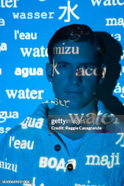 visual projection of pattern reading water in various languages cast on man, portrait - una palabra fotografías e imágenes de stock