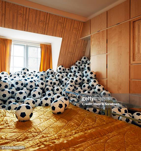 bedroom filled with footballs - large group of objects sport stock pictures, royalty-free photos & images