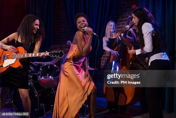 group of women performing jazz band on stage - jazz music guitar stock pictures, royalty-free photos & images