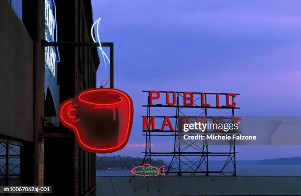 neon sign for caf? and market at dusk - seattle coffee stock pictures, royalty-free photos & images