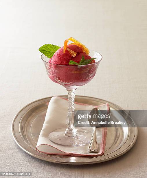 sherbet with orange peel on silver tray - fruit sorbet stock pictures, royalty-free photos & images