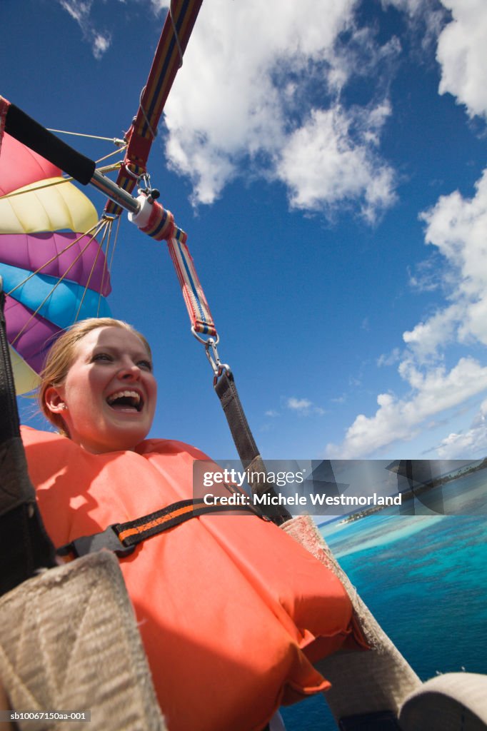French Polynesia, Bora Bora, Woman parasailing