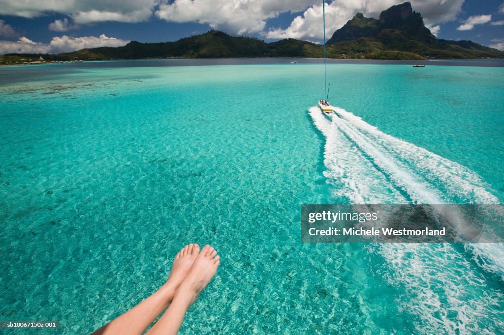 French Polynesia, Parasailing over lagoon of Bora Bora, Mount Otemanu in background