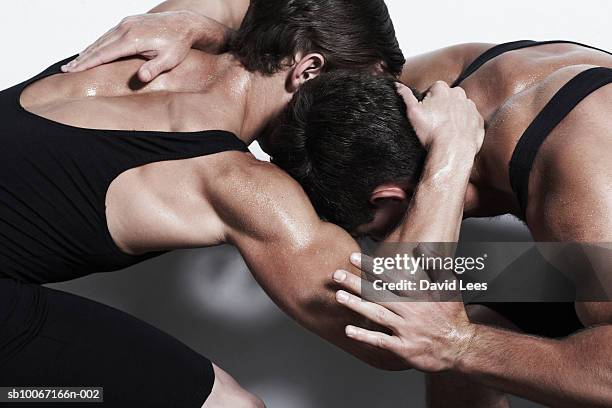 two young men wrestling, close-up - wrestling - fotografias e filmes do acervo