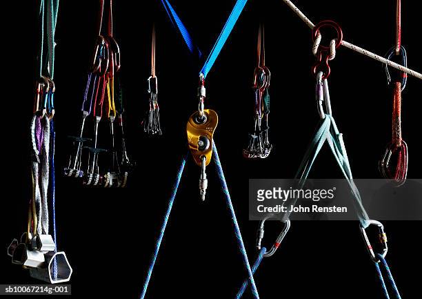 climbing equipment on black background - mountain climbing equipment stock pictures, royalty-free photos & images