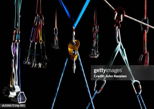 climbing equipment on black background - carabiner rope stock pictures, royalty-free photos & images
