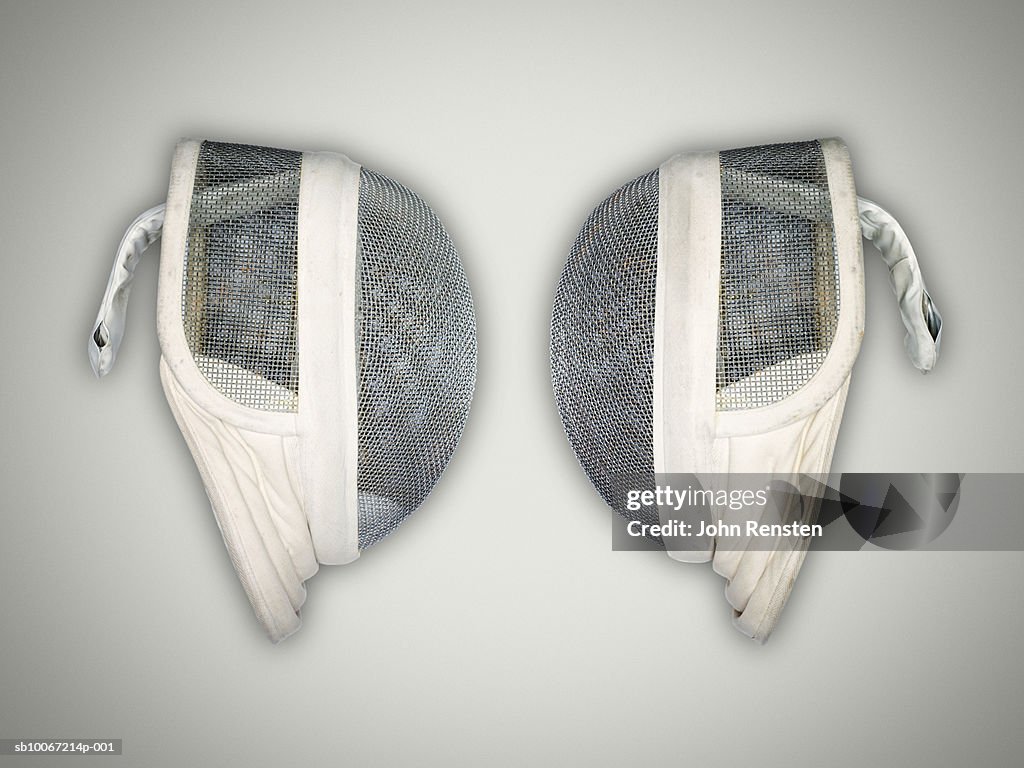 Two fencing masks, studio shot