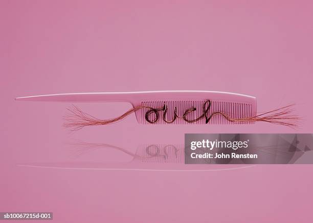 hair in comb, close-up - pink vanity stock pictures, royalty-free photos & images