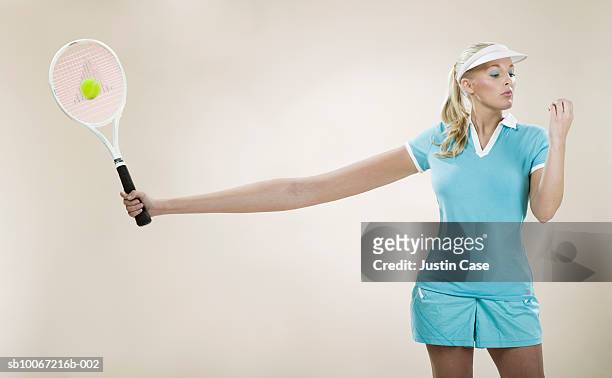 female tennis player with stretched out arm (digital composite) - lang fysieke beschrijving stockfoto's en -beelden