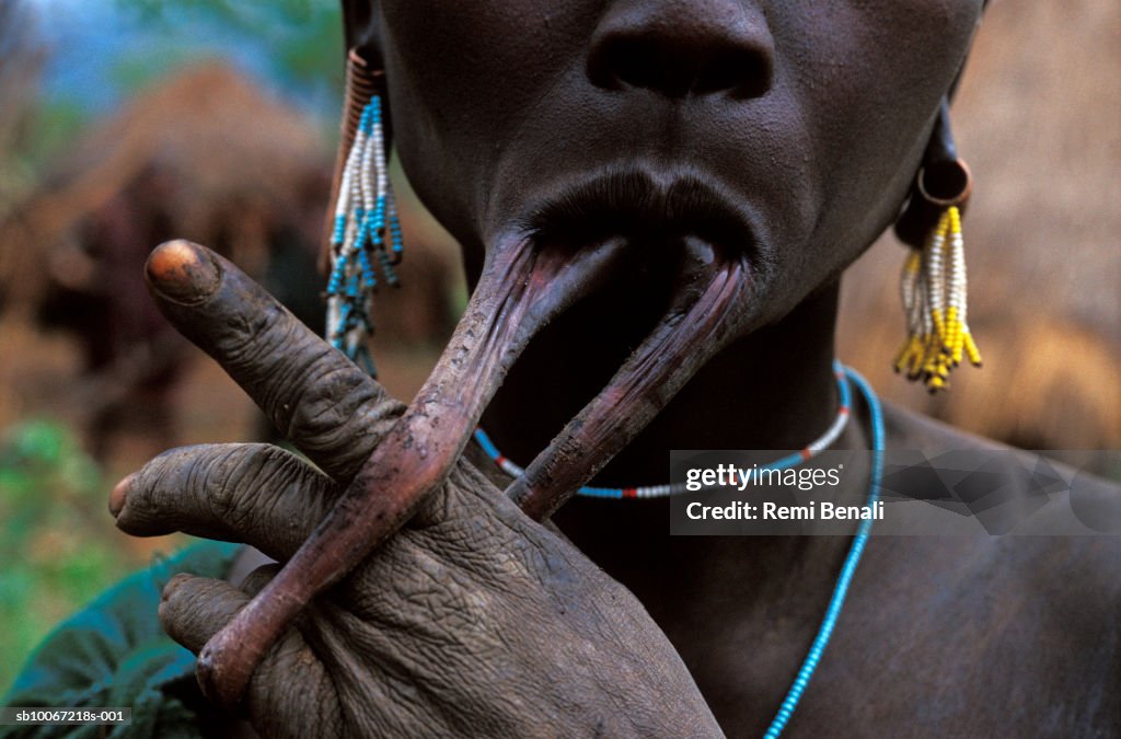 Ethiopia, Omo Valley, Surma tribe woman with stretched lip from lip plate, close-up