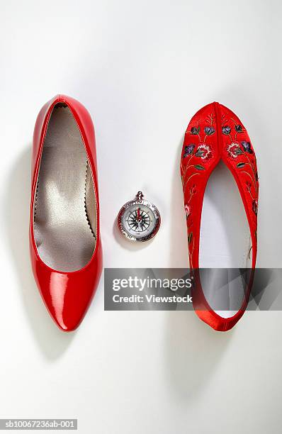 eastern and western woman's shoes with compass - eastern stock-fotos und bilder