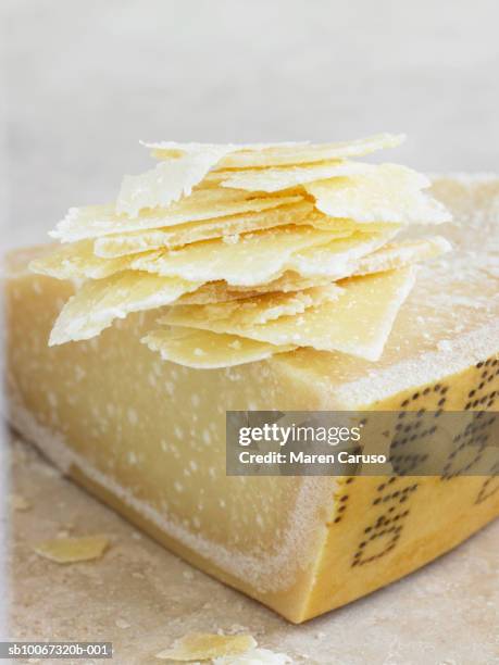 cheese with thin slices, close-up - parmesan stock-fotos und bilder