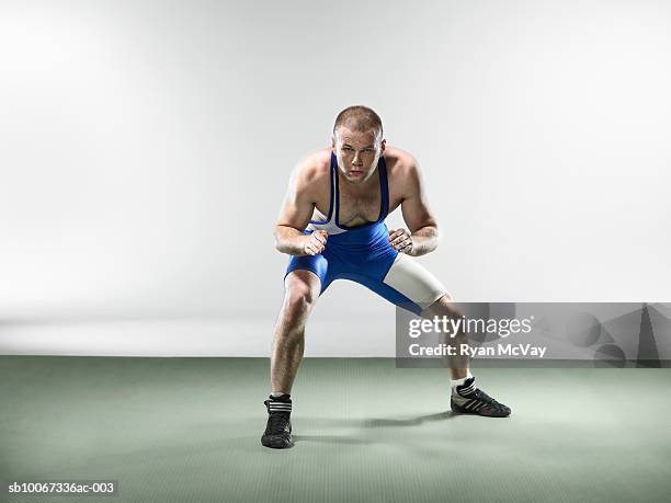 wrestler preparing to fight (studio shot) - wrestler stock-fotos und bilder