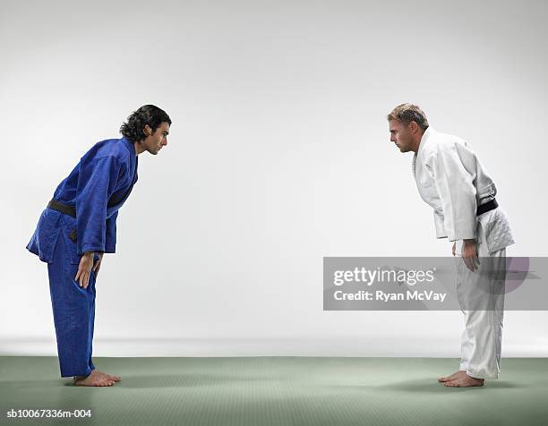 two men bowing before judo match - martial arts man stock pictures, royalty-free photos & images