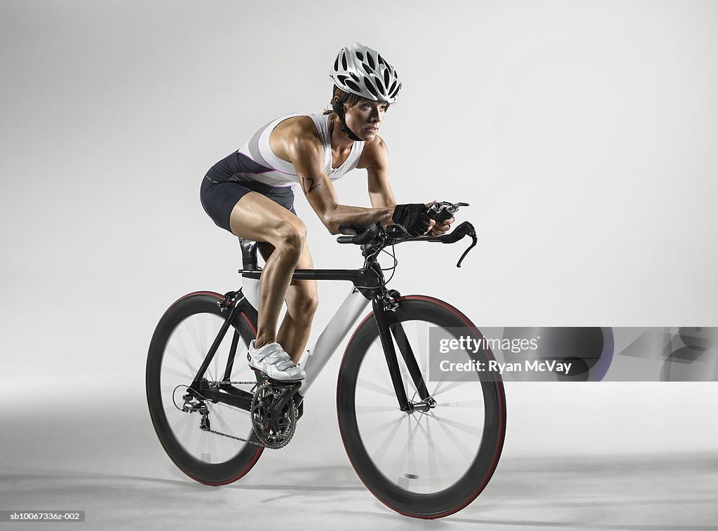 Cyclist in seated position (studio shot)