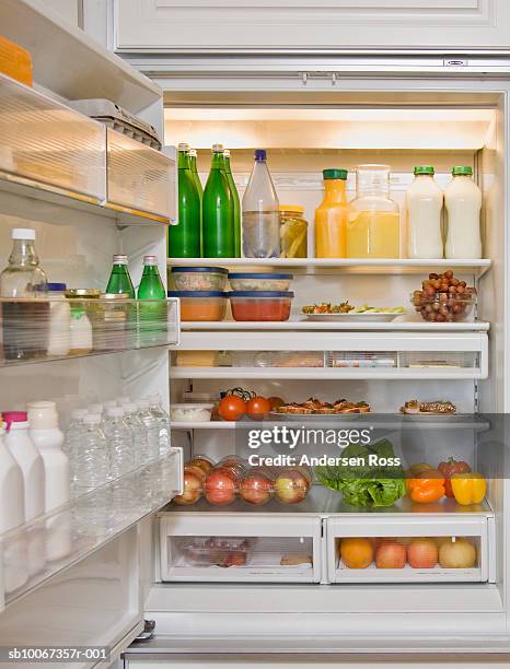 fridge filled with fruits and vegetables - koelkast stockfoto's en -beelden