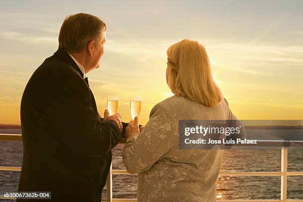 couple with champagne on cruise ship - railing stock pictures, royalty-free photos & images