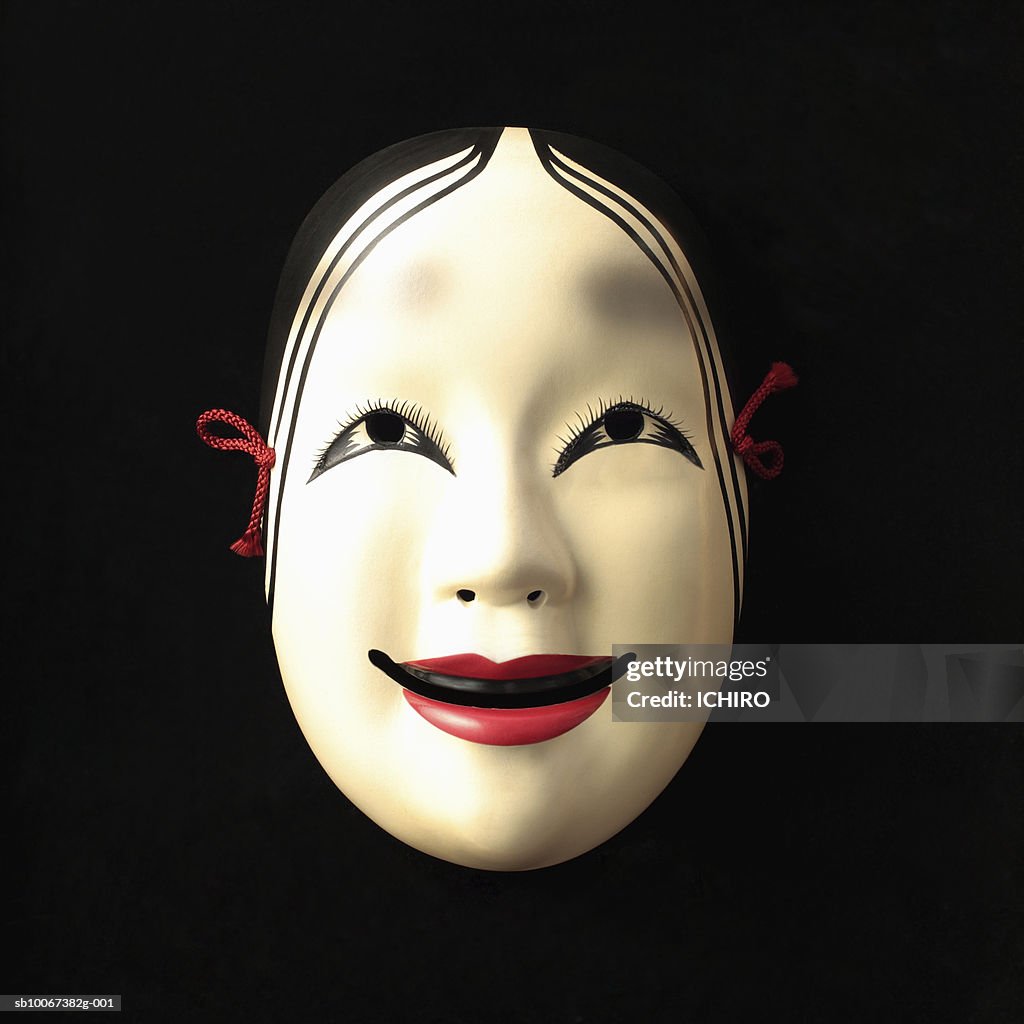 Noh mask on black background