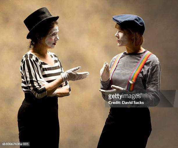 two female mimes having conversation - mime stock pictures, royalty-free photos & images